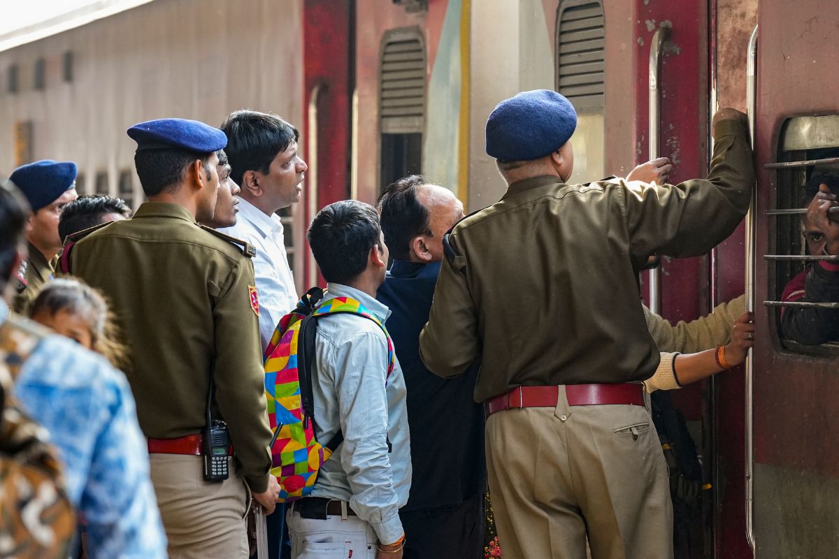 Security personnel manage passengers