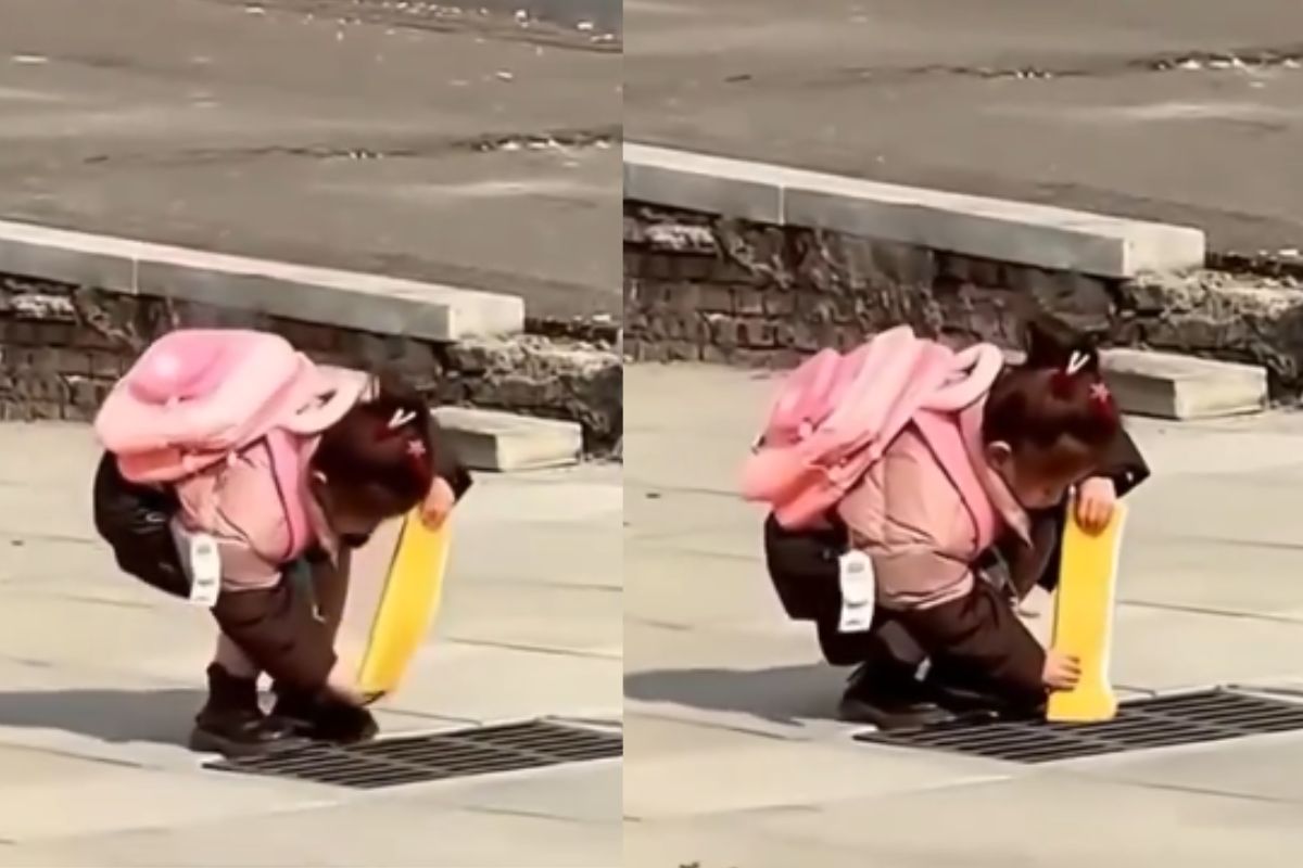 Viral Video of girl throwing book in gutter