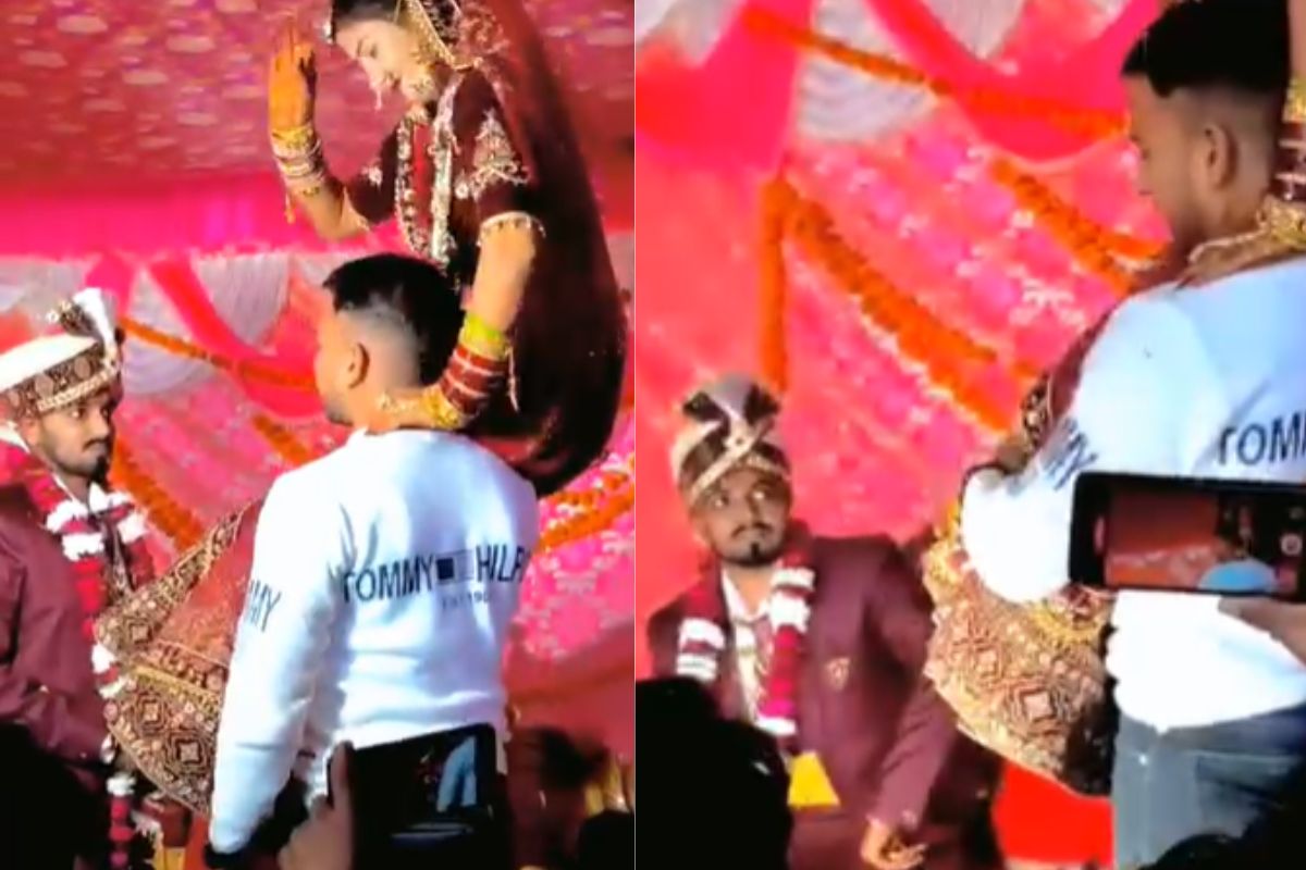 Bride brother pick her in lap during varmala groom not able to wear her garland and got angry