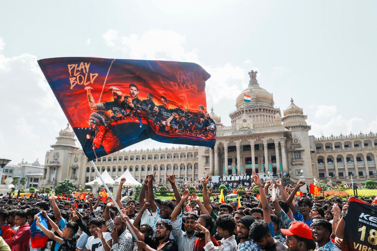 Royal Challengers Bengaluru fans climb