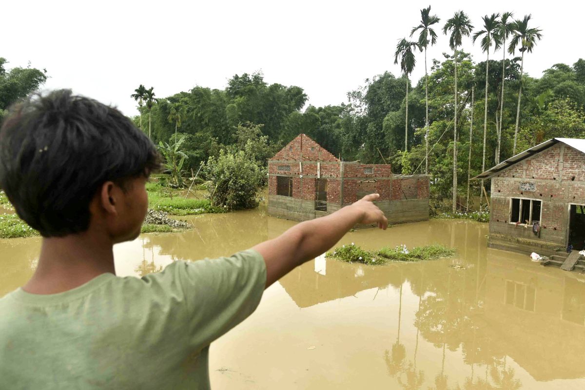 boy points to his house