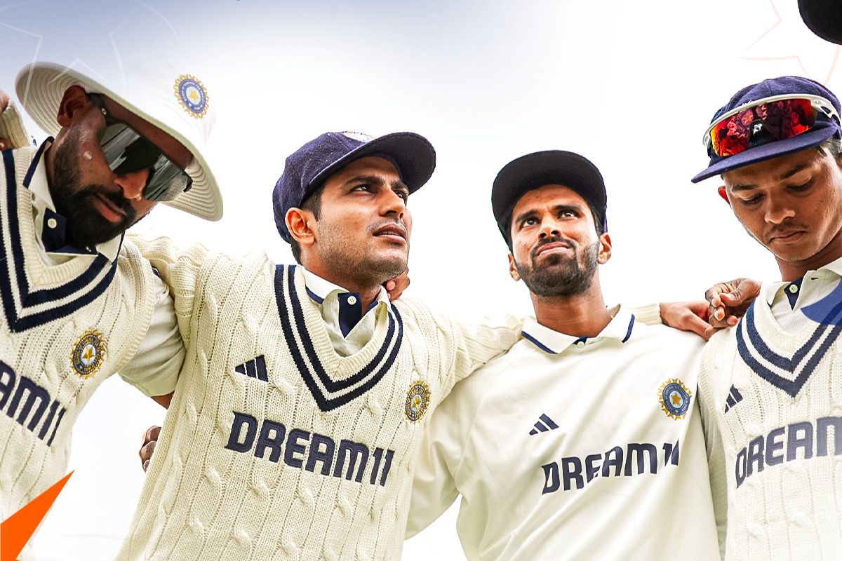 Shubman Gill with teammates in huddle.