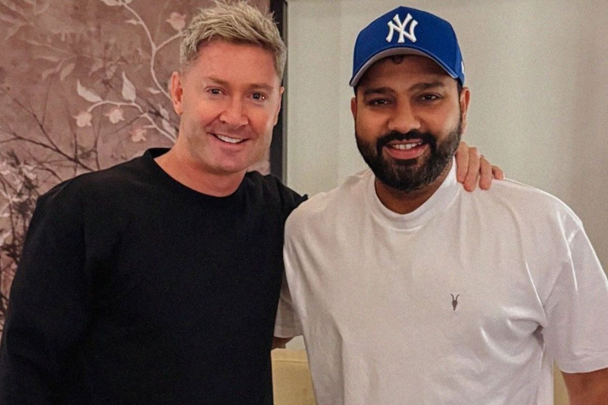 Michael Clarke with Rohit Sharma.