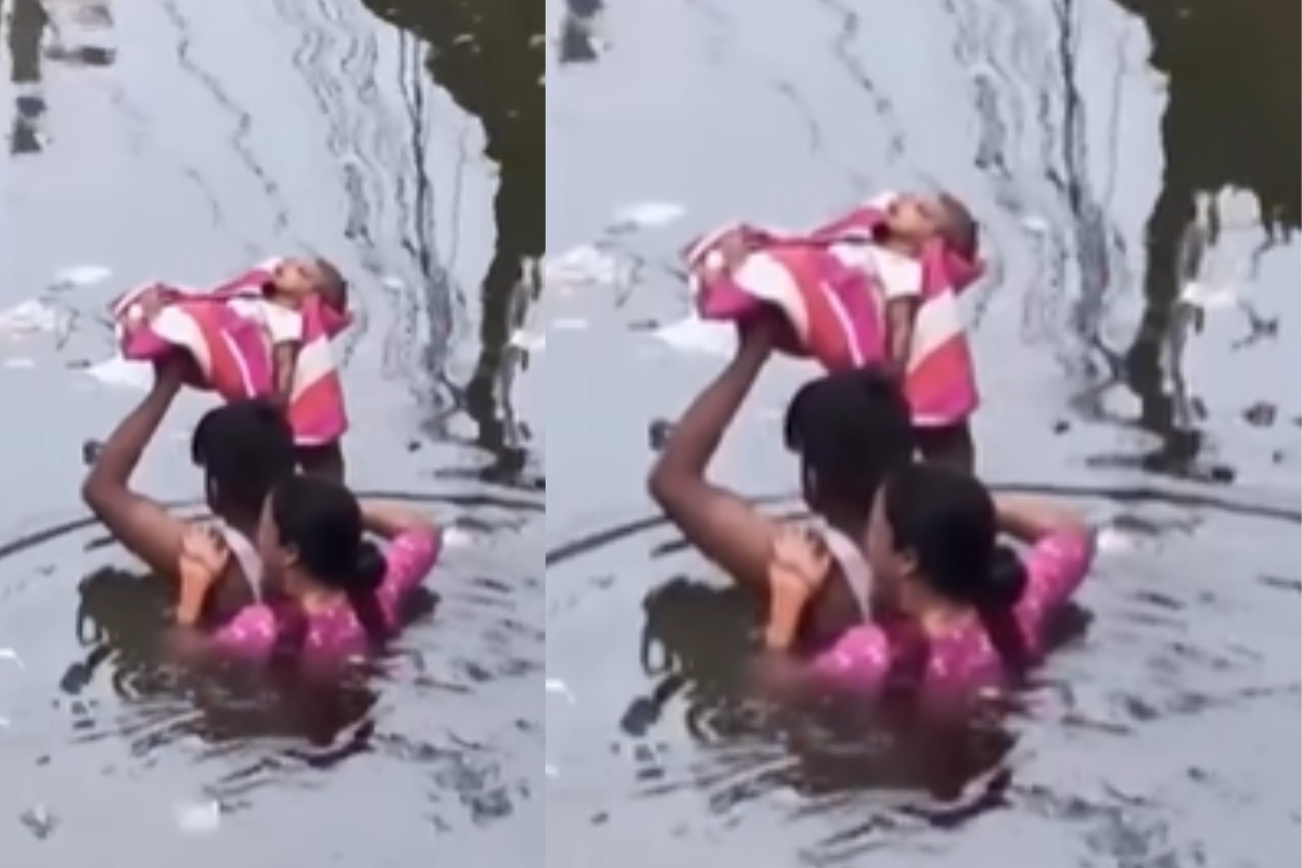 Viral Video father mother carry baby on head cross dirty waterlog road