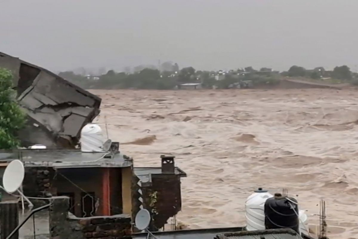 Tawi river flows in spate after relentless rainfall