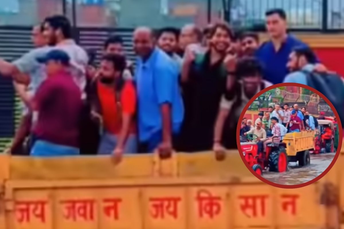 People sitting in Tractor Trolleys in Delhi