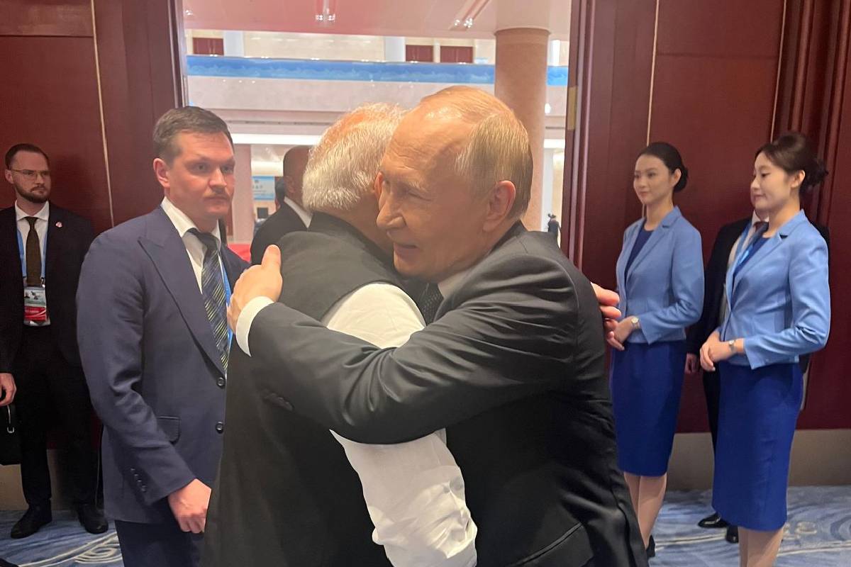 Vladimir Putin hugs PM Modi