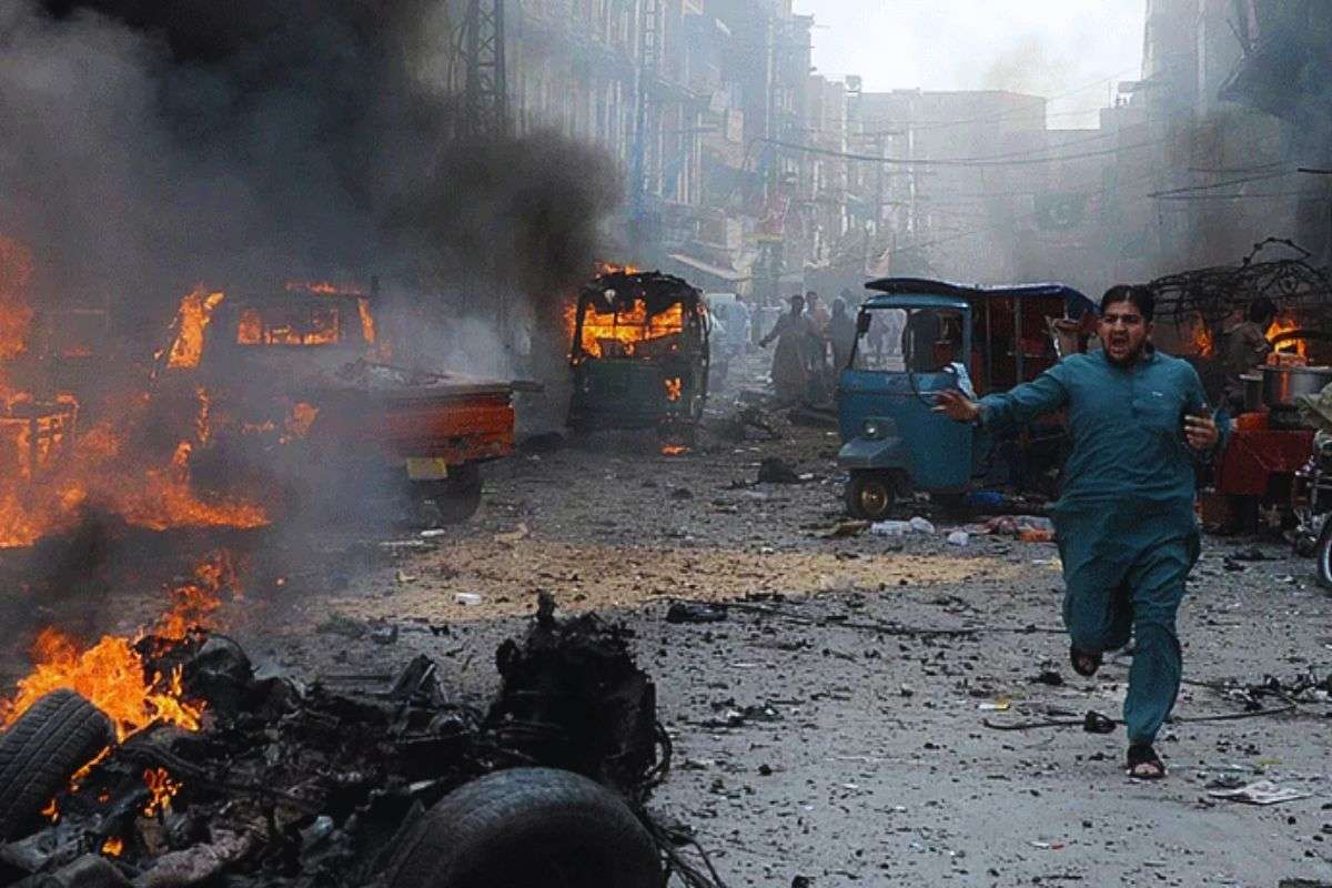 A Man running after an attack in Pakistan.