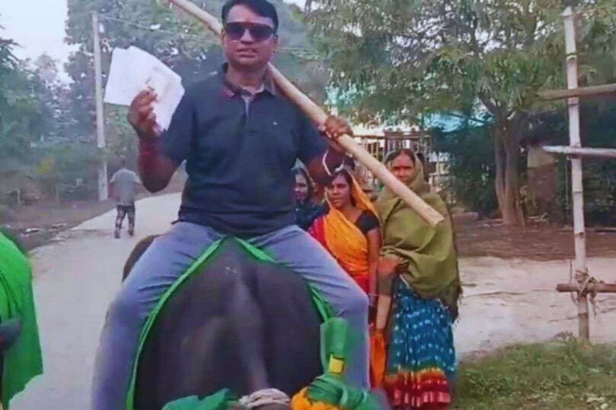 Voter rides a buffalo to cast his vote